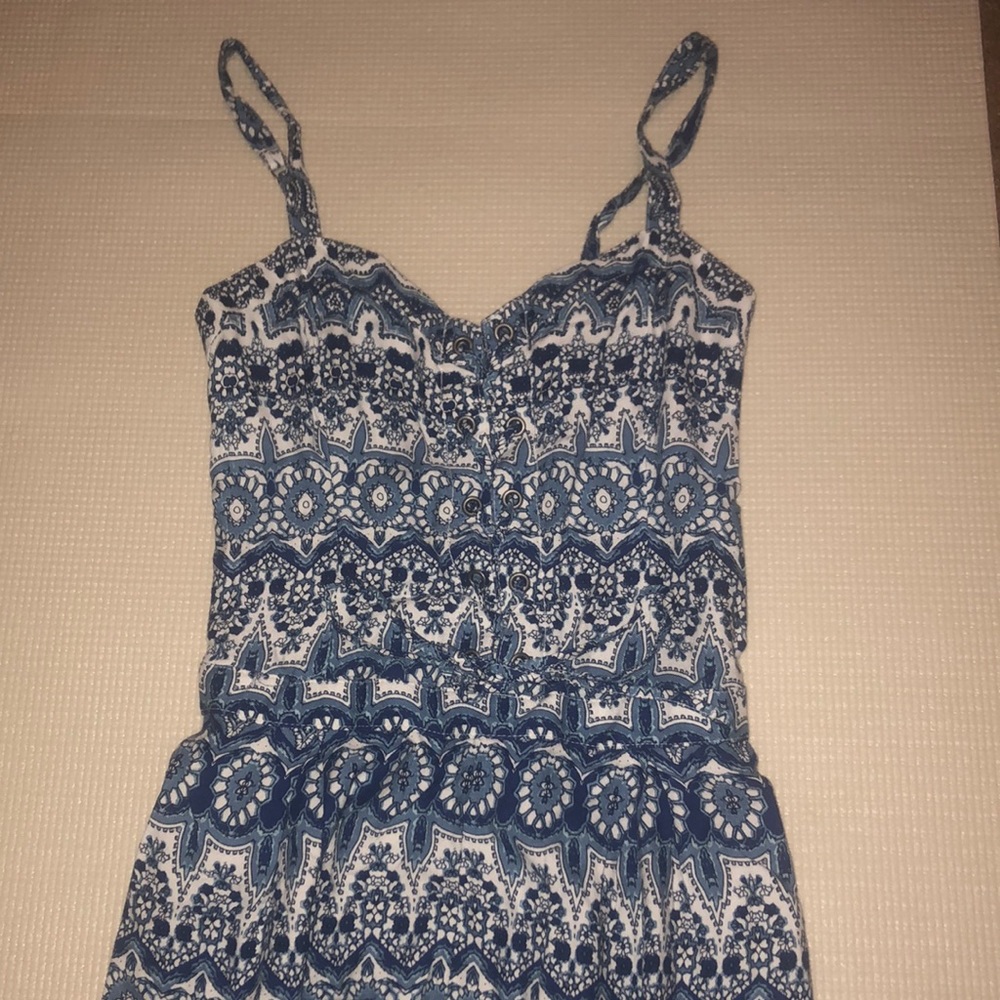 Blue and white floral print short romper.